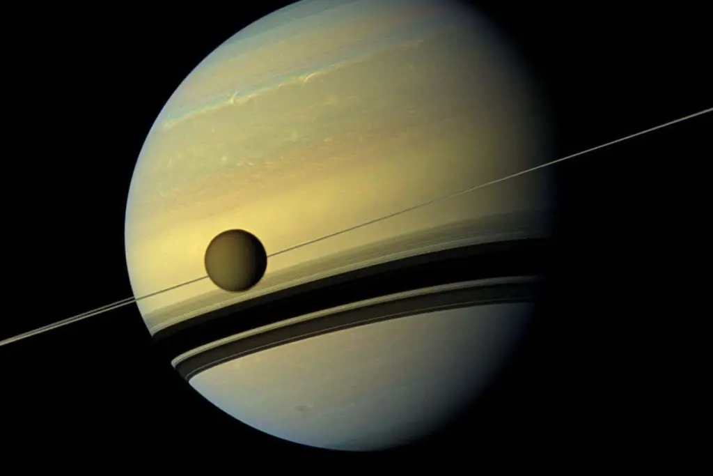 Titan's Cosmic Collision: A Theory Unifying Saturn's Mysteries
