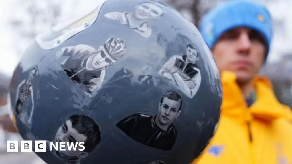 Ukrainian Athlete's Olympic Ban Sparks Controversy Over Helmet Tribute